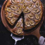 wooden tray with banana pie and pie server