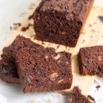 Double chocolate banana bread with slices cut out.