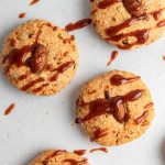 Baked cookies drizzled with dulce de leche.
