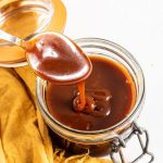 Spoon over butterscotch sauce in a jar.