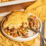 A plate with Shepherd's pie and a fork.
